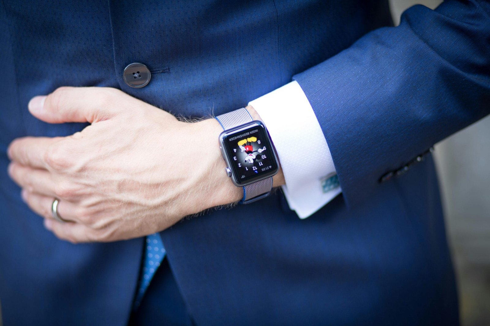 Man using a smartwatch for stress and anxiety management, showcasing digital tools to promote mental wellbeing.