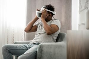 Person using a wearable mental health device, symbolizing how technology supports mental health management.